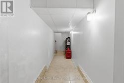 Tunnel from rec room to stairway to garage. - 