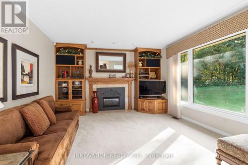 1410 Sherruby Way, Ottawa, ON - Indoor Photo Showing Living Room With Fireplace