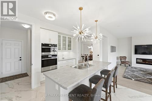 80 Explorer Way, Thorold, ON - Indoor Photo Showing Kitchen With Fireplace With Double Sink