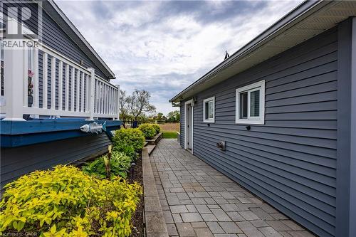 Stone Walkway between House and Detached Garage - 2 Hickory Hollow, Nanticoke, ON - Outdoor With Exterior