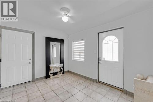 Entryway featuring neutral-toned tile flooring and white walls - 1 Galbraith Drive, Hamilton, ON - Indoor Photo Showing Other Room