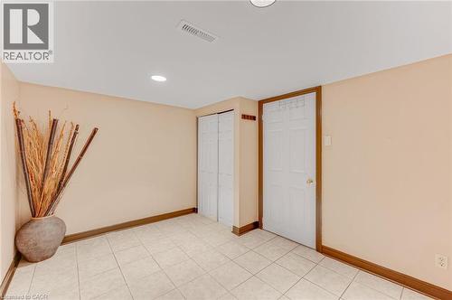 Room featuring tile flooring, neutral wall paint, white trim, and recessed lighting - 1 Galbraith Drive, Hamilton, ON - Indoor Photo Showing Other Room