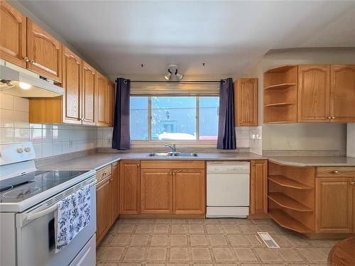 64 Noonan Drive, Brandon, MB - Indoor Photo Showing Kitchen With Double Sink