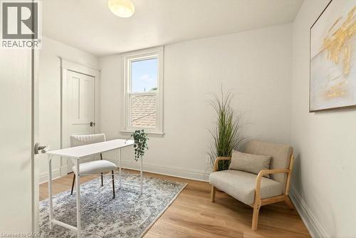 Bright room featuring wood-finish flooring and a single window with white trim - 106 Grosvenor Avenue N, Hamilton, ON - Indoor Photo Showing Other Room