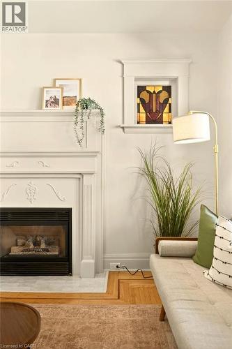 106 Grosvenor Avenue N, Hamilton, ON - Indoor Photo Showing Bedroom With Fireplace