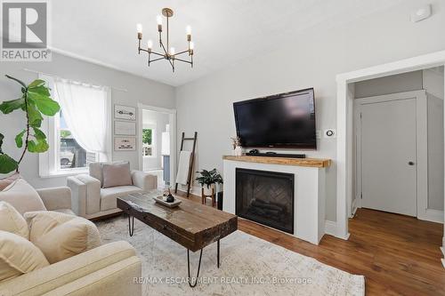 23 East 21St Street, Hamilton, ON - Indoor Photo Showing Living Room With Fireplace
