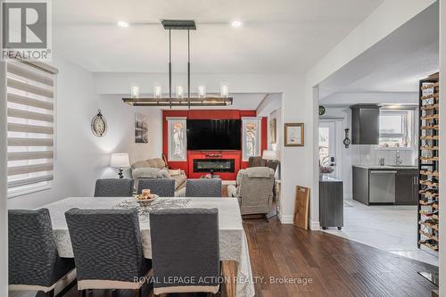 87 Grandville Circle, Brant, ON - Indoor Photo Showing Dining Room With Fireplace