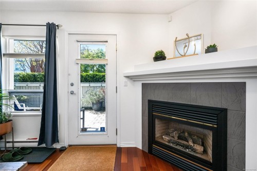 #109-380 Waterfront Cres, Victoria, BC - Indoor Photo Showing Living Room With Fireplace