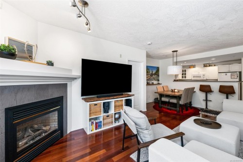 #109-380 Waterfront Cres, Victoria, BC - Indoor Photo Showing Living Room With Fireplace