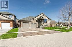 The property features a brick and stone facade with a two-car garage - 