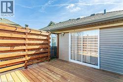 The property features a wooden deck with a privacy fence, offering an outdoor area - 