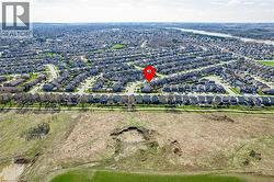 Aerial view of the residential area with a river visible in the distance - 