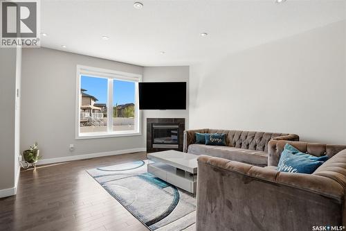 4113 Green Willow Terrace E, Regina, SK - Indoor Photo Showing Living Room With Fireplace