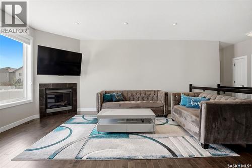 4113 Green Willow Terrace E, Regina, SK - Indoor Photo Showing Living Room With Fireplace