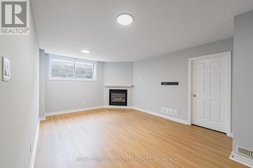 132 Mancini Way E, Ottawa, ON - Indoor Photo Showing Living Room With Fireplace
