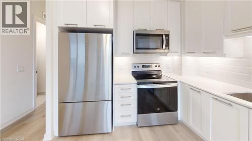 Gorgeous modern kitchen - 385 Winston Road Unit# 709, Grimsby, ON - Indoor Photo Showing Kitchen With Upgraded Kitchen