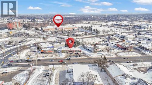 Aerial perspective of a commercial area featuring multiple business establishments - 402 King Street N, Waterloo, ON 