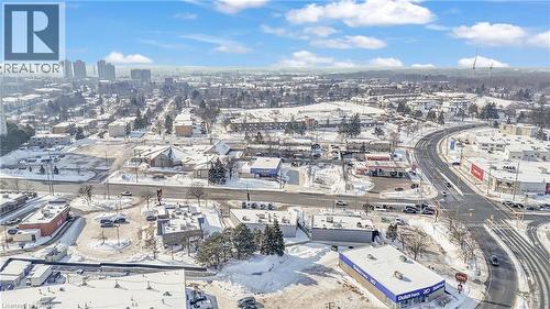 Expansive aerial perspective showcasing a snowy urban landscape with a clear blue sky - 402 King Street N, Waterloo, ON 