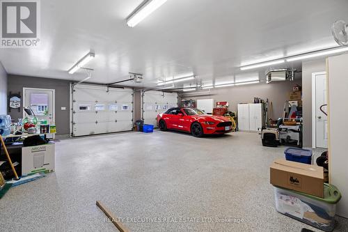 Fully FinishedOversized Double Garage - 10727 West End Terrace, South Dundas, ON - Indoor Photo Showing Garage