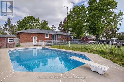 Digitally enhanced photo until pool is cleaned - 667 Skyline Road, Selwyn, ON - Outdoor With In Ground Pool With Backyard
