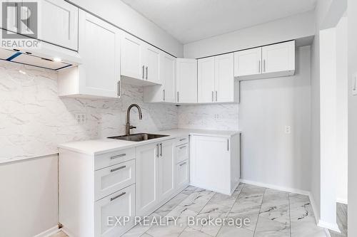 New -Cabinets - Floor - Fish Scale Tile Backslash - 404 B - 2044 Arrowsmith Drive, Ottawa, ON - Indoor Photo Showing Kitchen