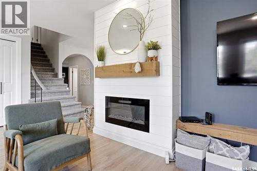 10 Louise Crescent, Regina, SK - Indoor Photo Showing Living Room With Fireplace