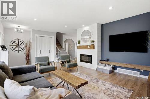 10 Louise Crescent, Regina, SK - Indoor Photo Showing Living Room With Fireplace