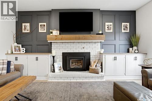 10 Louise Crescent, Regina, SK - Indoor Photo Showing Living Room With Fireplace