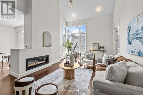 Bright Living room with 17 foot ceilings - 143 Stonemeadow Drive, Ottawa, ON - Indoor Photo Showing Living Room With Fireplace