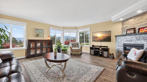 303-2420 Ingram Road, West Kelowna, BC - Indoor Photo Showing Living Room With Fireplace
