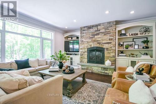 33 Reilly'S Run, Springwater, ON - Indoor Photo Showing Living Room With Fireplace