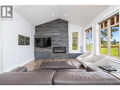 251 Predator Ridge Drive Unit# 42, Vernon, BC - Indoor Photo Showing Living Room With Fireplace