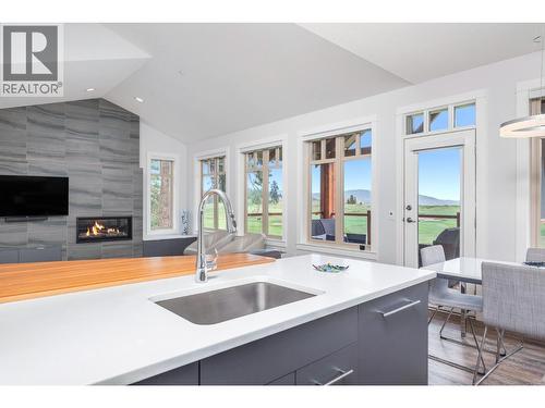 251 Predator Ridge Drive Unit# 42, Vernon, BC - Indoor With Fireplace
