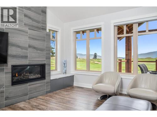251 Predator Ridge Drive Unit# 42, Vernon, BC - Indoor Photo Showing Living Room With Fireplace