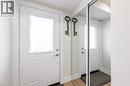 Entryway featuring a white paneled door with an upper glass insert, brushed nickel hardware, and wood-finish flooring - 185 Highland Crescent Unit# 2, Kitchener, ON  - Indoor Photo Showing Other Room 