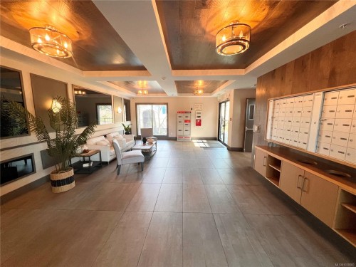 #105-745 Travino Lane, Saanich, BC - Indoor Photo Showing Other Room With Fireplace