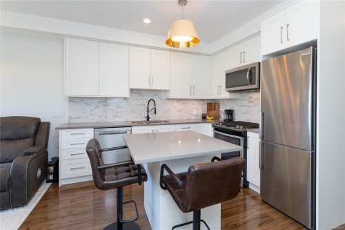#105-745 Travino Lane, Saanich, BC - Indoor Photo Showing Kitchen With Stainless Steel Kitchen With Upgraded Kitchen