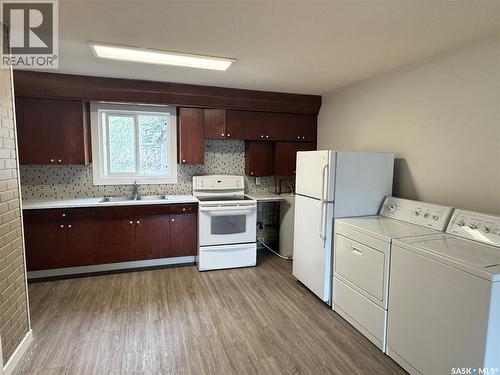 127 2Nd Avenue W, Biggar, SK - Indoor Photo Showing Kitchen With Double Sink