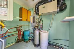 Utility room neatly tucked off the garage. - 