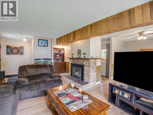 609 201St Avenue, Castlegar, BC - Indoor Photo Showing Living Room With Fireplace