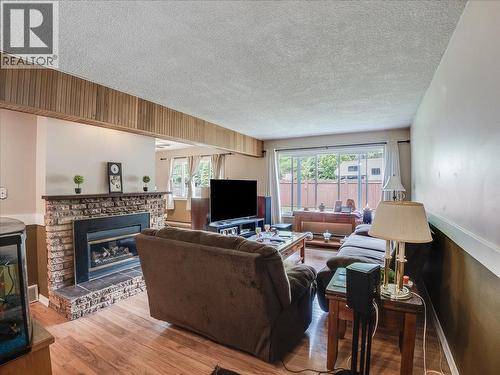 609 201St Avenue, Castlegar, BC - Indoor Photo Showing Living Room With Fireplace