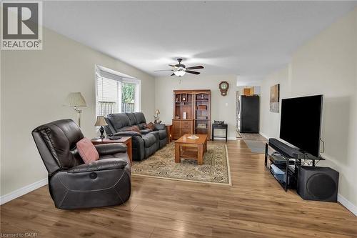 Living room featuring light wood finished floors and a ceiling fan - 4432 Dennis Avenue, Beamsville, ON - Indoor Photo Showing Living Room