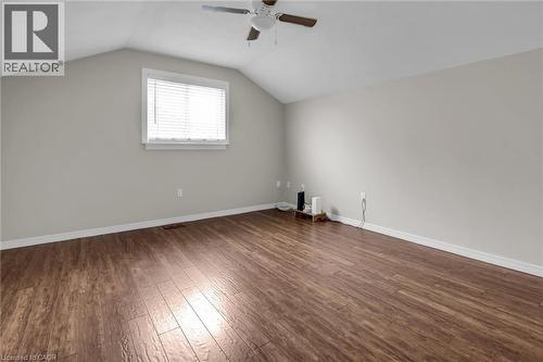 Bedroom with ceiling fan, dark wood flooring, and vaulted ceiling - 4432 Dennis Avenue, Beamsville, ON - Indoor Photo Showing Other Room