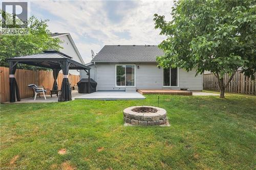 Back of property with an outdoor fire pit, a gazebo, a fenced backyard, and a patio - 4432 Dennis Avenue, Beamsville, ON - Outdoor
