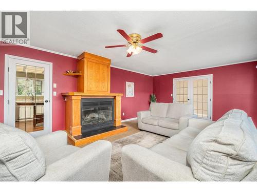 6960 Brewer Road, Coldstream, BC - Indoor Photo Showing Living Room With Fireplace