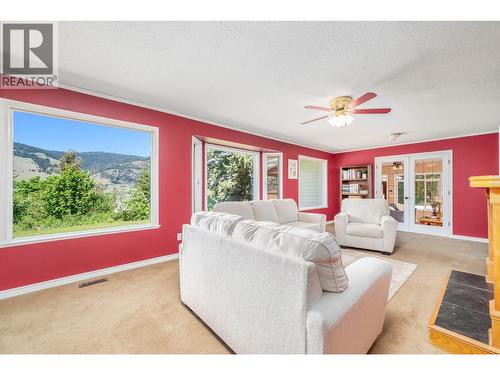 6960 Brewer Road, Coldstream, BC - Indoor Photo Showing Living Room With Fireplace