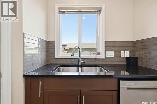 414 Maningas Bend, Saskatoon, SK - Indoor Photo Showing Kitchen With Double Sink