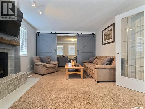 419 Clasky Drive, Estevan, SK - Indoor Photo Showing Living Room With Fireplace