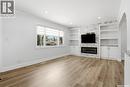 124 Riddell Crescent, Regina, SK  - Indoor Photo Showing Living Room With Fireplace 