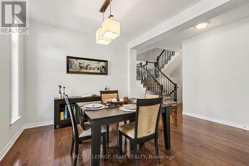 Dining room towards rear of home with open stair - 65 Osprey Crescent, Ottawa, ON 
